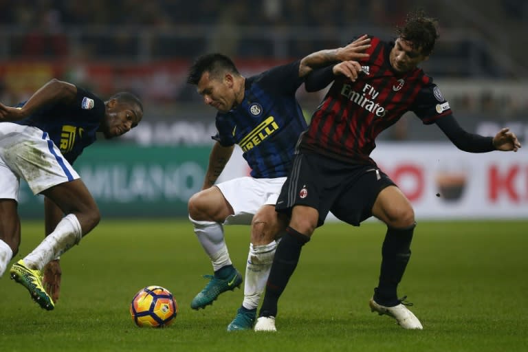 Inter Milan's Gary Alexis Medel (centre) in action during an Italian league match against AC Milan on November 20, 2016