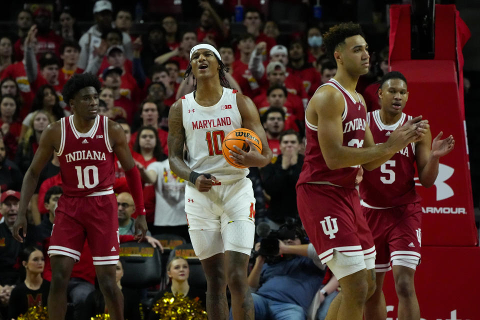 Maryland forward Julian Reese, center, reacts after a play as Indiana's Kaleb Banks, left, Trayce Jackson-Davis, second from right, and Malik Reneau, right, look on during the first half of an NCCA college basketball game, Tuesday, Jan. 31, 2023, in College Park, Md. (AP Photo/Julio Cortez)