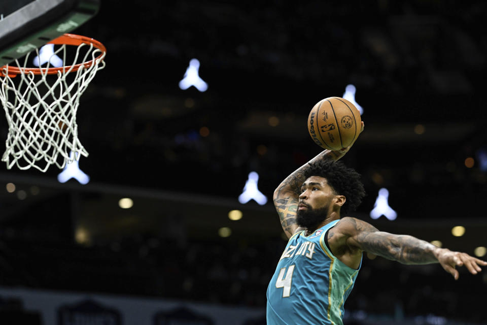 Charlotte Hornets center Nick Richards (4) goes up for a slam dunk during the first half of an NBA basketball game against the Brooklyn Nets, Saturday, March 9, 2024, in Charlotte, N.C. (AP Photo/Matt Kelley)