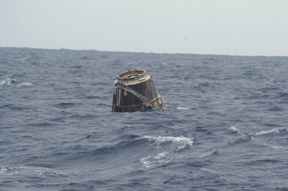 SpaceX's first Dragon capsule to visit the International Space Station bobs in the Pacific Ocean after a successful splashdown that capped its successful test flight on May 31, 2012. The capsule landed off the coast of Baja California. <cite>SpaceX/Michael Altenhofen</cite>