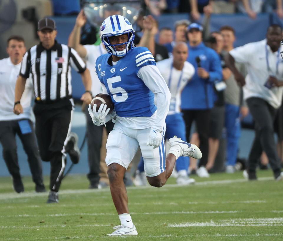 Brigham Young Cougars cornerback Eddie Heckard (5) runs the ball after his interception against the Texas Tech Red Raiders in Provo on Saturday, Oct. 21, 2023. BYU won 27-14. | Jeffrey D. Allred, Deseret News