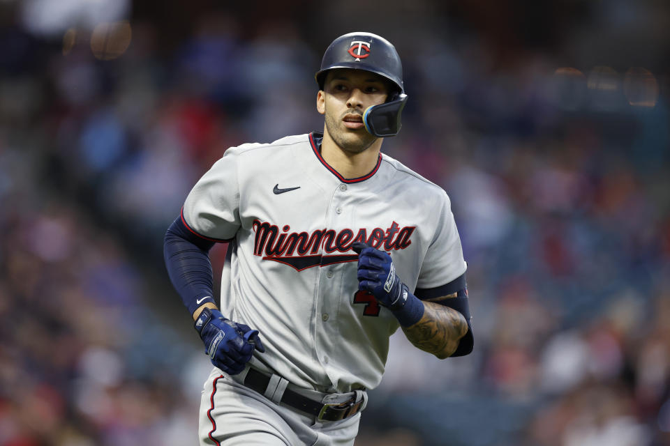 FILE - Minnesota Twins' Carlos Correa rounds the bases after hitting a two-run home run against the Cleveland Guardians during the seventh inning of a baseball game Monday, June 27, 2022, in Cleveland. Minnesota Twins shortstop Carlos Correa formally opted out of his contract to become a free agent, the MLB Players' Association announced Monday, Nov. 7, 2022. (AP Photo/Ron Schwane, File)