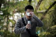 A professor of Pusan National University Park Hyun who used to be a coronavirus patient, drinks a warm water upon his arrival to Pusan National University in Busan