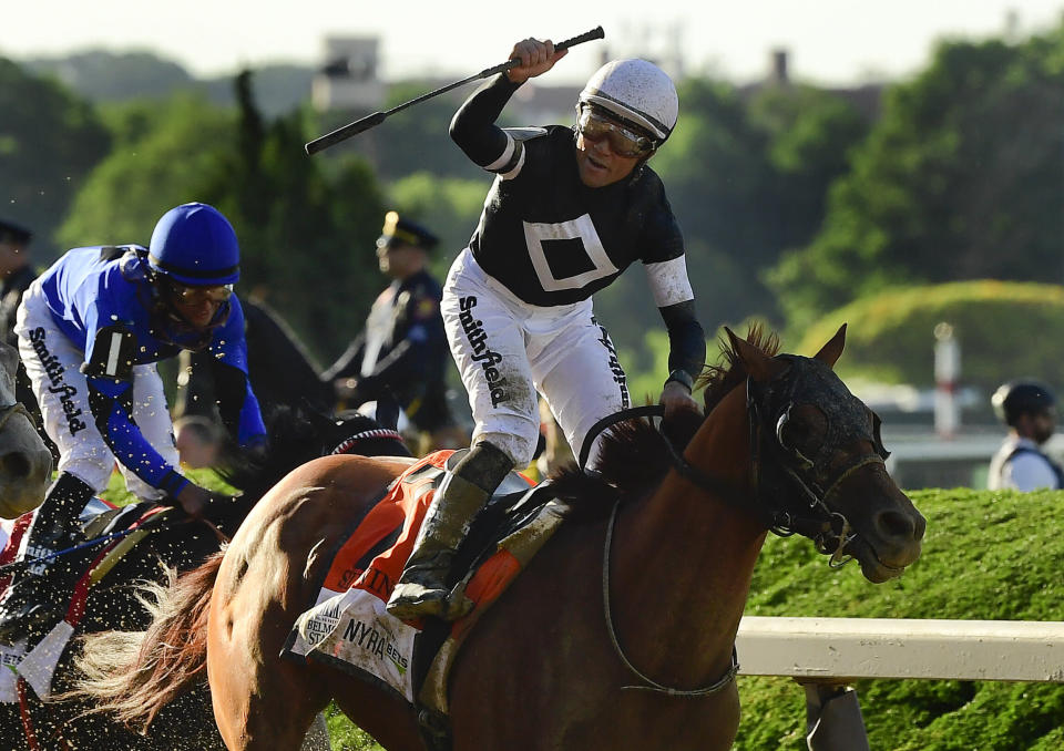 Jockey Joel Rosario reacts atop Sir Winston (7) after winning the 151st running of the Belmont Stakes horse race , Saturday, June 8, 2019, in Elmont, N.Y. (AP Photo/Steven Ryan)