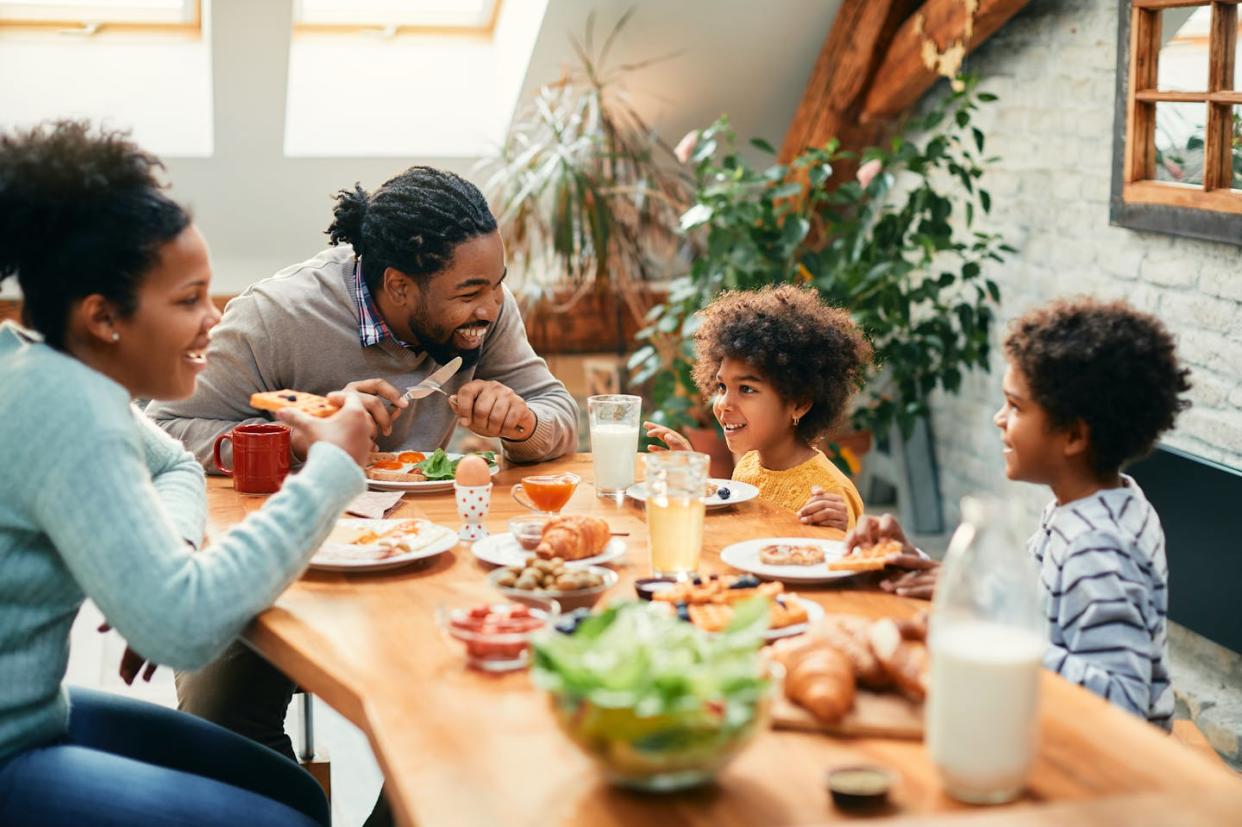 The relatively new discipline of epigenetics explores how diet and nutrition can affect not only our own health but that of future generations. <a href="https://www.gettyimages.com/detail/photo/happy-african-american-family-enjoying-in-royalty-free-image/1355162946?phrase=family+eating+at+dinner+table&adppopup=true" rel="nofollow noopener" target="_blank" data-ylk="slk:Drazen Zigic/iStock via Getty Images Plus;elm:context_link;itc:0;sec:content-canvas" class="link ">Drazen Zigic/iStock via Getty Images Plus</a>