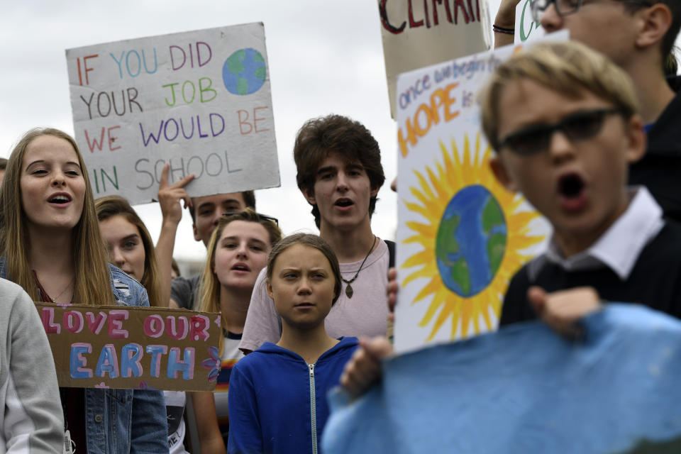 Swedish youth climate activist Greta Thunberg, center in blue, joins other young climate activists Friday for a climate strike outside the White House in Washington, Friday, Sept. 13, 2019. (AP Photo/Susan Walsh)