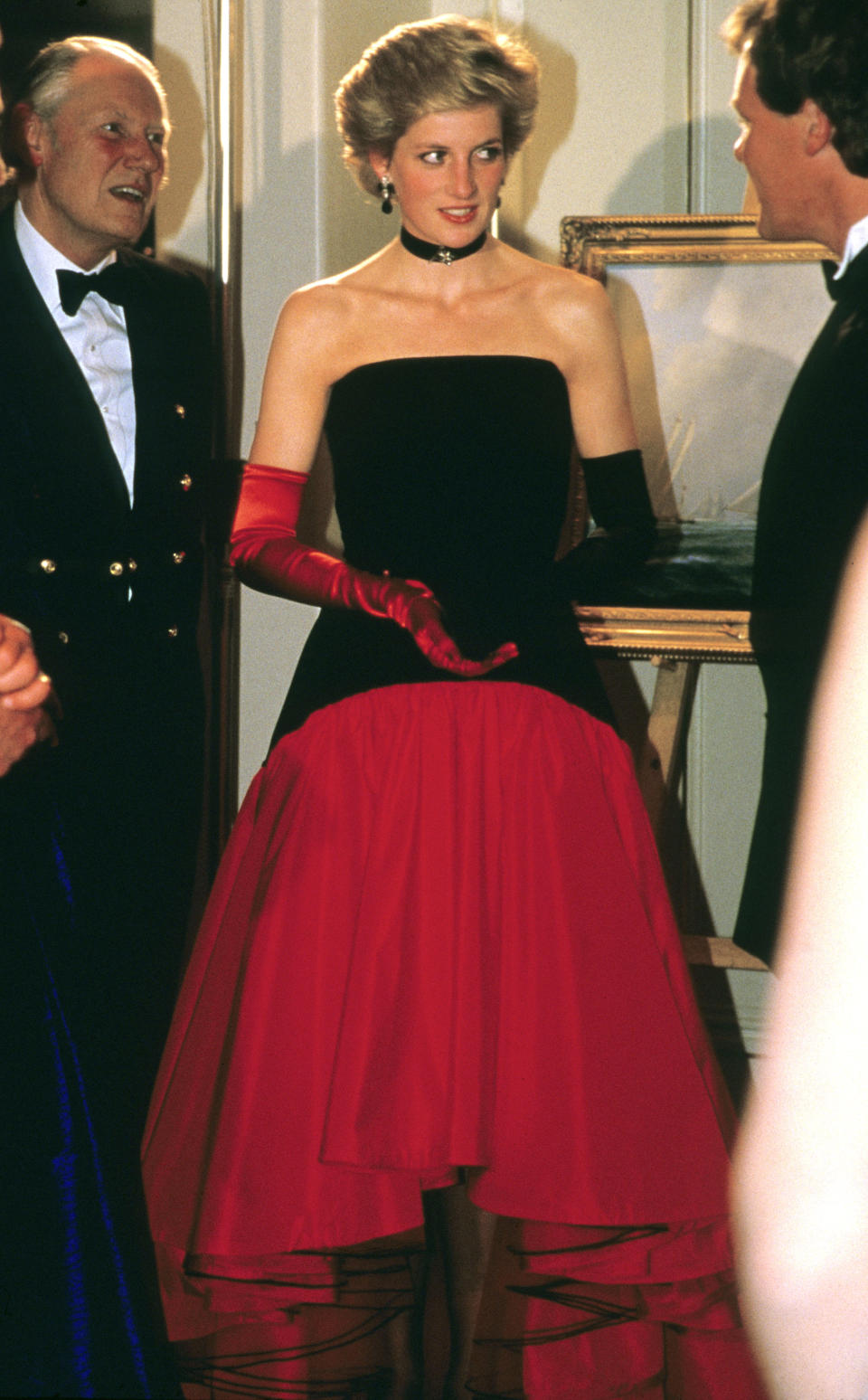 <p> This flamenco ball gown designed by Murray Arbeid (who also designed at least one other cool, architectural gown for Diana) is truly one of the more fun and daring dresses that Diana ever wore as a royal. The contrasting opera gloves, the matching black choker—it may have been for the America's Cup Ball, but that doesn't mean formal had to be boring. It was also a hint at the fun and sometimes quirky style that Diana was capable of. </p>