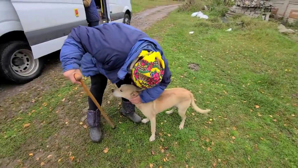 A woman in Ukraine's Kherson was surprised to be reunited with her dog. (SWNS)