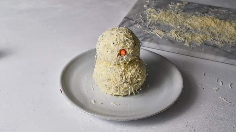 snowman cheese ball on plate