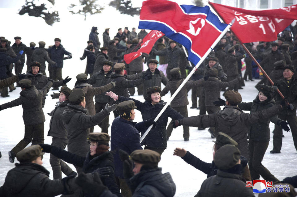 In this Monday, Dec. 2, 2019, photo provided Tuesday, Dec. 3, 2019, by the North Korean government, people dance to celebrate the completion of Samjiyon city. On Monday, North Korean leader Kim Jong Un visited Samjiyon county at the foot of Mount Paektu to attend a ceremony marking the completion of work that has transformed the town to “an epitome of modern civilization,” KCNA said. It said the town has a museum on the Kim family, a ski slope, cultural centers, a school, a hospital and factories. Independent journalists were not given access to cover the event depicted in this image distributed by the North Korean government. The content of this image is as provided and cannot be independently verified. Korean language watermark on image as provided by source reads: "KCNA" which is the abbreviation for Korean Central News Agency. (Korean Central News Agency/Korea News Service via AP)