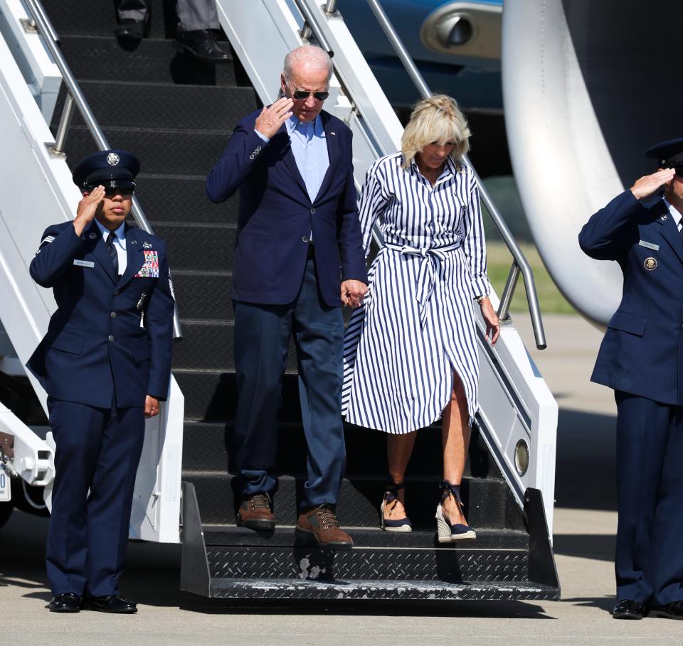 President Joe Biden, left, and First Lady Jill Biden depart Air Force One after landing at the Blue Grass Airport in Lexington, Ky. on Aug. 8, 2022.