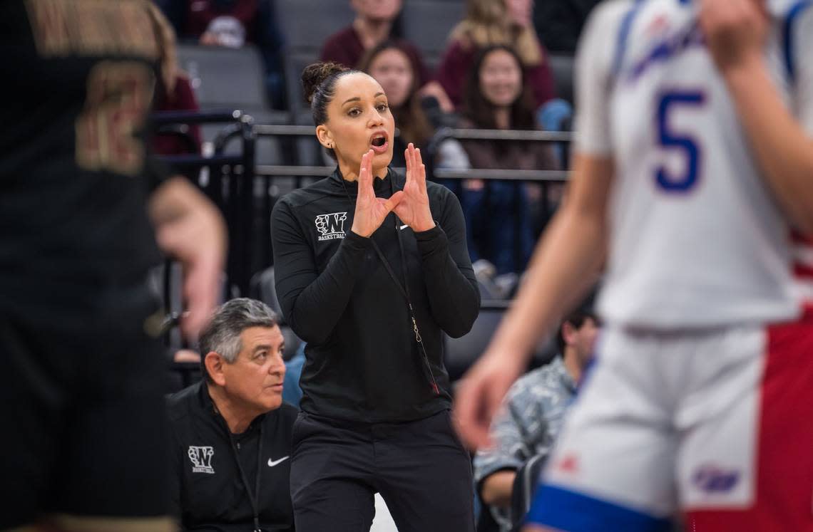 Whitney Wildcats head coach Sydney Gatson communicates with her players during the first quarter against the Christian Brothers Falcons in a CIF Sac-Joaquin Section Division II high school girls basketball final in 2023 at Golden 1 Center.
