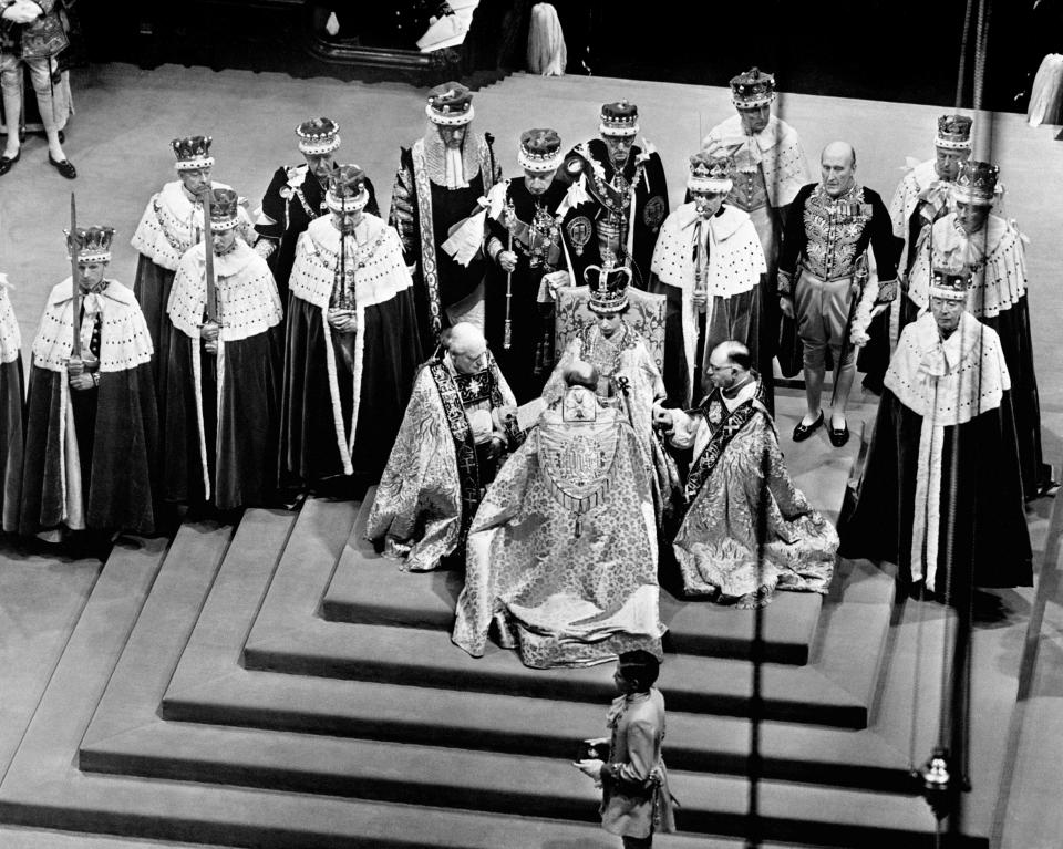 <p>The new queen, Elizabeth II, on the throne as the bishops pay homage during her coronation on 2 June 1953. (Getty Images)</p> 