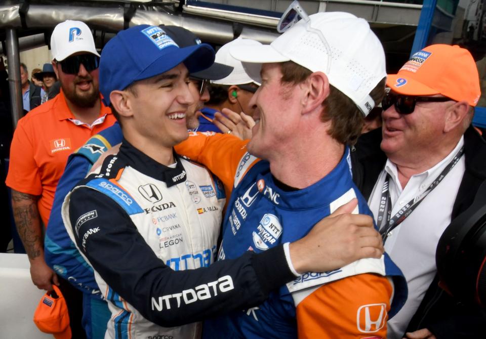 Chip Ganassi Racing driver Álex Palou (10) and Chip Ganassi Racing driver Scott Dixon (9) celebrate after claiming the top two spots Sunday, May 22, 2022, during the second day of qualifying for the 106th running of the Indianapolis 500 at Indianapolis Motor Speedway