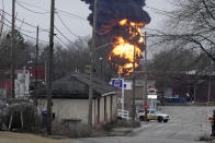 A black plume and fireball rise over East Palestine, Ohio, as a result of a controlled detonation of a portion of the derailed Norfolk and Southern trains Monday, Feb. 6, 2023. (AP Photo/Gene J. Puskar)