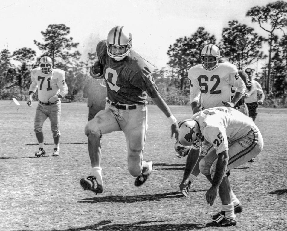 Alan Alda, as George Plimpton, crashes through for short yardage in the movie adaptation of Plimpton's book "Paper Lion".