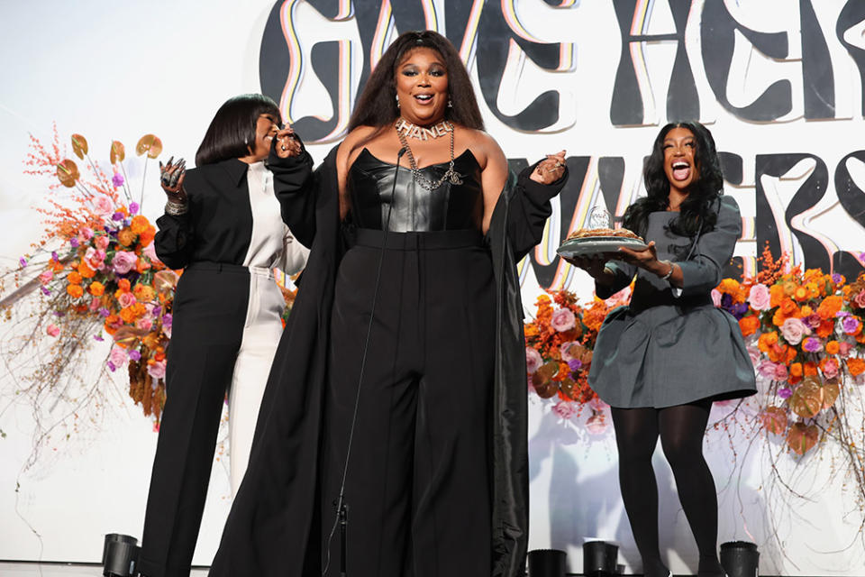 Heather Lowery and Lizzo celebrate SZA's birthday with a pie at Femme It Forward Give Her FlowHERS Gala 2023 at The Beverly Hilton on November 10, 2023 in Beverly Hills, California.