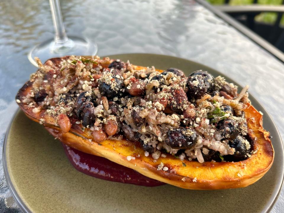 Miijim's stuffed squash is filled with tepary bean, maize morada, wild rice, cedar and fresh blueberries.
