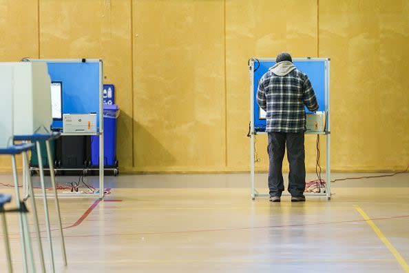 OAKLAND, CALIFORNIA - MARCH 5: A voter casts their ballot at the Allen Temple Baptist Church voting center on March 5, 2024 in Oakland, United States. 15 States and one U.S. Territory hold their primary elections on Super Tuesday, awarding more delegates than any other day in the presidential nominating calendar.  (Photo by Philip Pacheco/Getty Images)