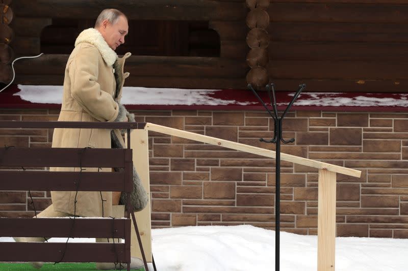 Russian President Putin takes a dip in icy waters during celebrations of the Orthodox Christian feast of Epiphany in Moscow Region