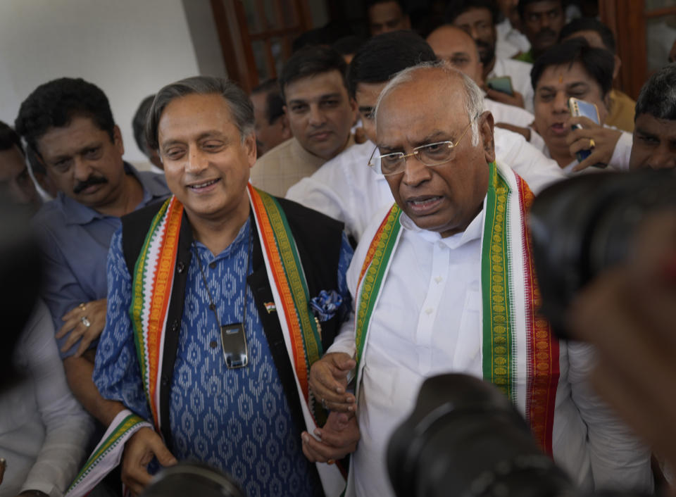 Newly elected president of India’s main opposition Congress party Mallikarjun Kharge, right and his challenger, Shashi Tharoor talk to the media after the election results, in New Delhi, India, Wednesday, Oct. 19, 2022. Kharge was elected new president in a contest in which the Nehru-Gandhi family, which has led the party for more than two decades, did not compete. (AP Photo/Manish Swarup)