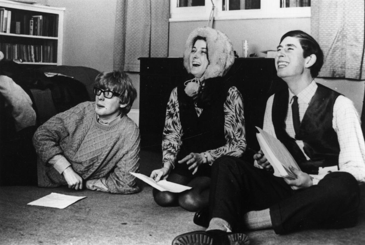 1969:  Charles, Prince of Wales reading through a play with his undergraduate friends whilst sitting on the floor of a Cambridge study.  (Photo by Central Press/Getty Images)