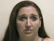 Megan Huntsman is shown in this booking photo provided by the Pleasant Grove County Jail in Pleasant Grove, Utah April 13, 2014. Huntsman was arrested and booked on suspicion of murder early April 13, 2014 after police found the decomposing bodies of seven infants stuffed in separate cardboard boxes in her former home, authorities said. REUTERS/Pleasant Grove County Jail/Handout via Reuters (UNITED STATES - Tags: CRIME LAW HEADSHOT PROFILE) ATTENTION EDITORS - THIS PICTURE WAS PROVIDED BY A THIRD PARTY. REUTERS IS UNABLE TO INDEPENDENTLY VERIFY THE AUTHENTICITY, CONTENT, LOCATION OR DATE OF THIS IMAGE. THIS PICTURE IS DISTRIBUTED EXACTLY AS RECEIVED BY REUTERS, AS A SERVICE TO CLIENTS. FOR EDITORIAL USE ONLY. NOT FOR SALE FOR MARKETING OR ADVERTISING CAMPAIGNS