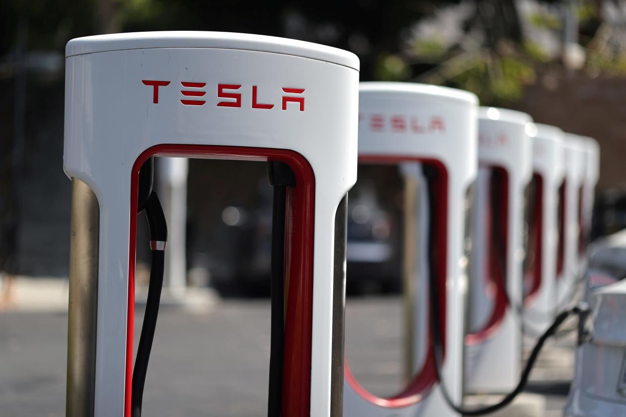 FILE PHOTO: A Tesla SuperCharger station is seen in Los Angeles, California, U.S., July 9, 2020.  REUTERS/Lucy Nicholson