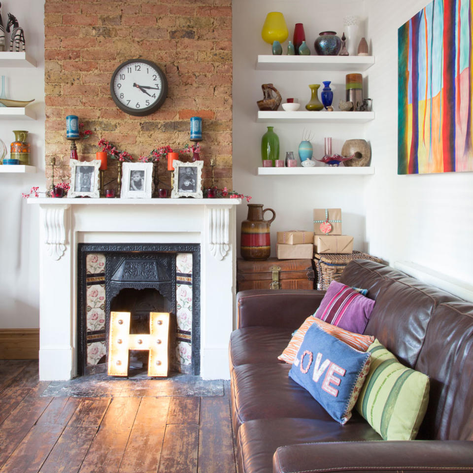 small living room with leather sofa and fireplace