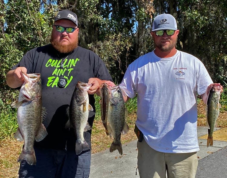 Roger Haslett, left, and Dustin Vaughn had 18.14 pounds and also had big bass with a 7.54 pounder to win the Polk County Bass AssassinÕs tournament Feb. 18 on Lake Juliana. 