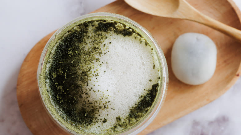 matcha latte with mochi and spoon