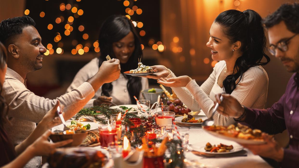  Friends having Christmas dinner. 