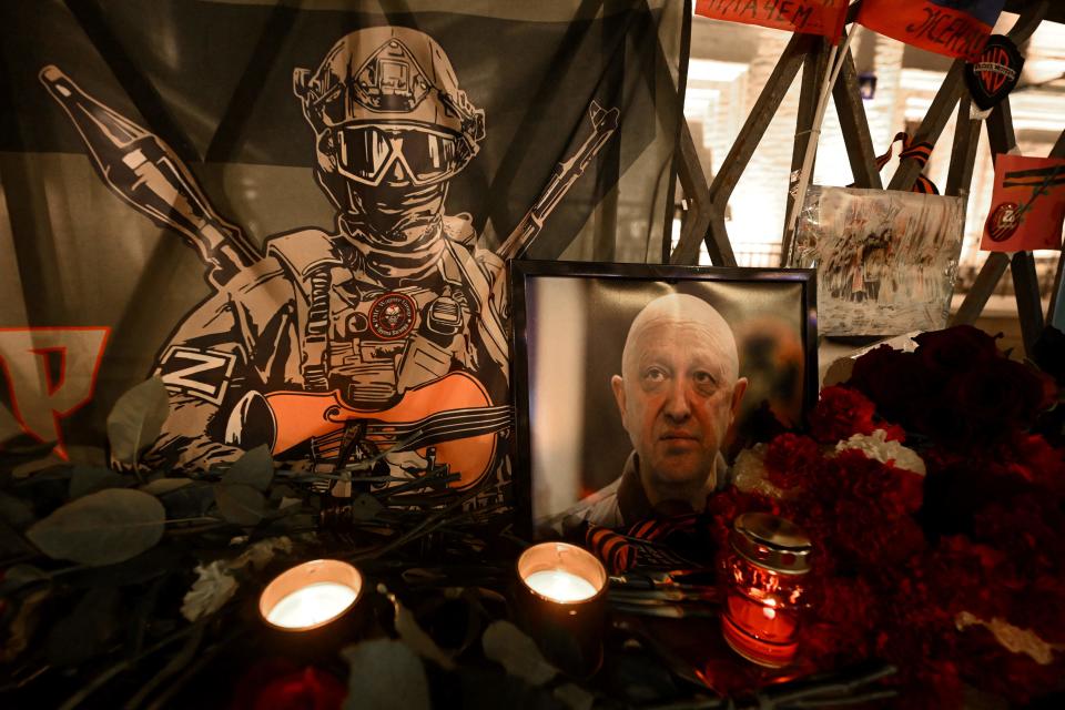 A portrait of Yevgeny Prigozhin, the head of the Wagner group, is seen at the makeshift memorial in Moscow (AFP via Getty Images)