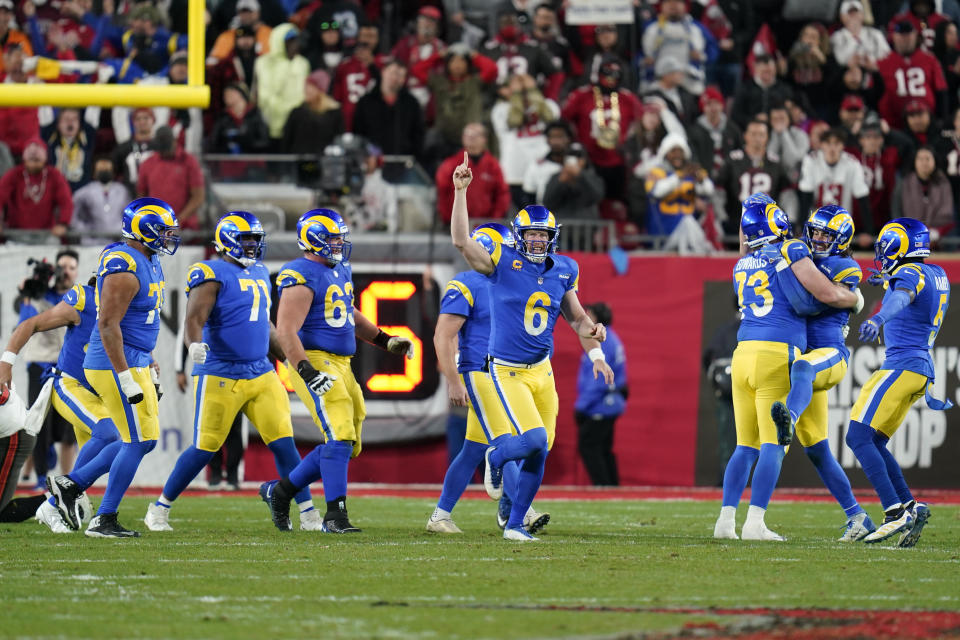 Los Angeles Rams holder Johnny Hekker (6) celebrates with teammates after kicker Matt Gay kicked the game-winning field goal against the Tampa Bay Buccaneers during the final seconds of an NFL divisional round playoff football game, Sunday, Jan. 23, 2022, in Tampa, Fla. (AP Photo/John Raoux)