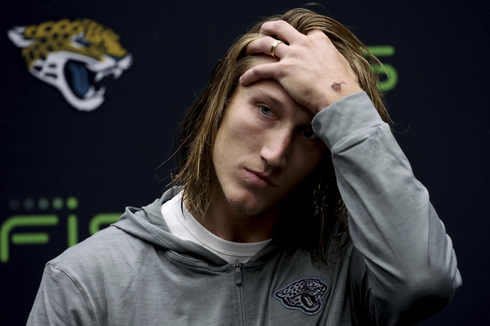 Jacksonville Jaguars quarterback Trevor Lawrence (16) reacts during a press conference after the NFL football game between Denver Broncos and Jacksonville Jaguars at Wembley Stadium in London, Sunday, Oct. 30, 2022. Jaguars lost by 17-21. (AP Photo/Ian Walton)