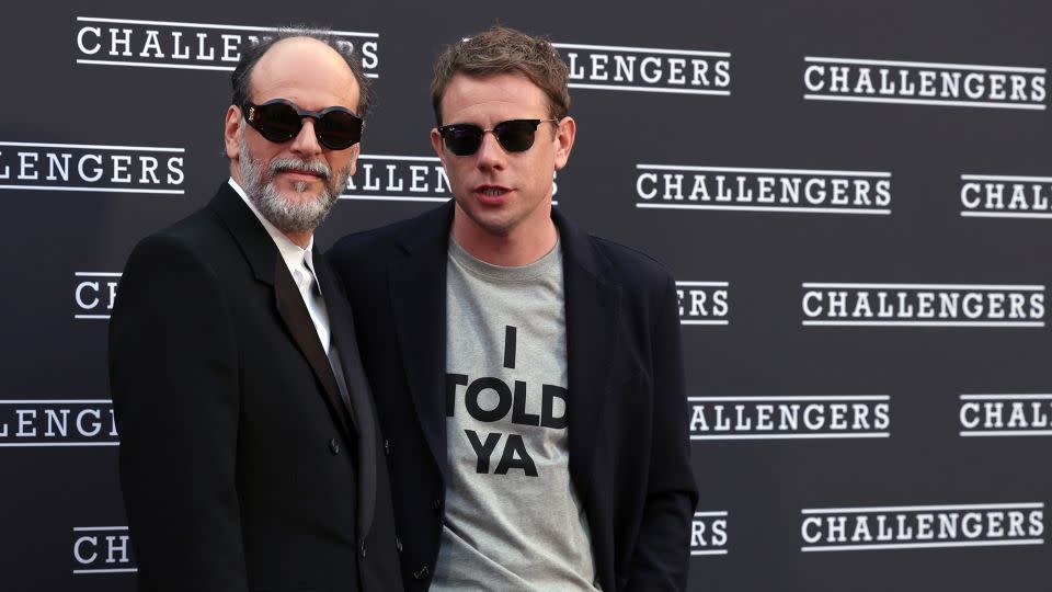 Pictured here with "Challengers" director Luca Guadagnino, designer Jonathan Anderson (right) in a piece straight out of the movie's wardrobe department. - Elisabetta A. Villa/Getty Images =