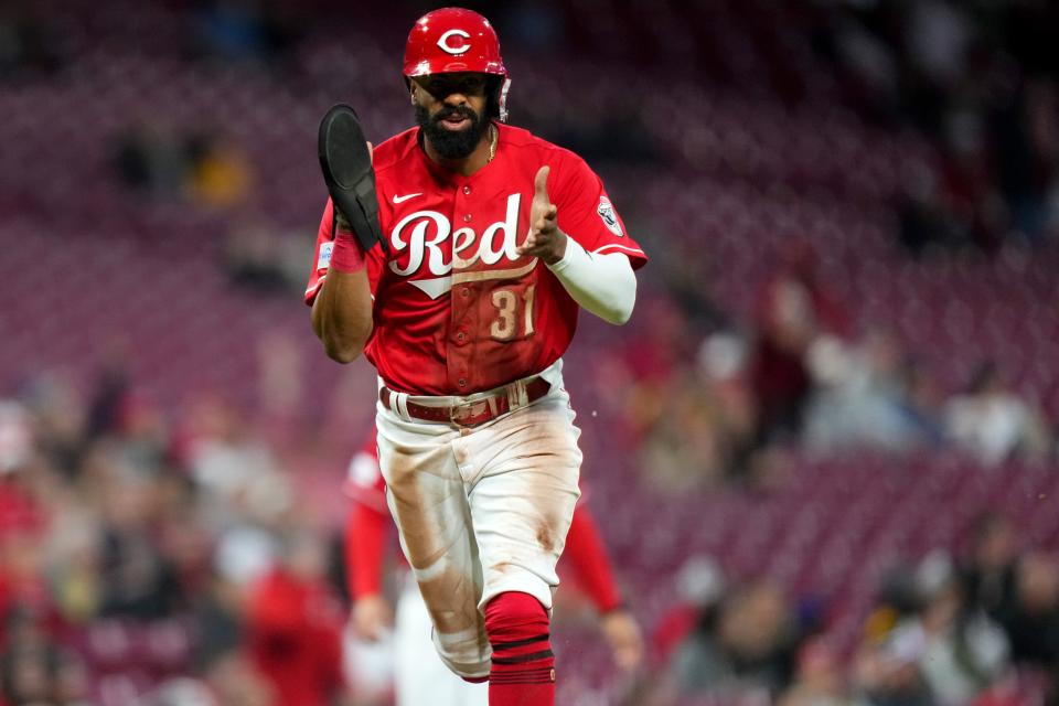 Cincinnati Reds outfielder Henry Ramos (31) scores in the seventh inning during a baseball game between the Texas Rangers at the Cincinnati Reds, Tuesday, April 25, 2023, at Great American Ball Park in Cincinnati.  The Cincinnati Reds won, 7-6.