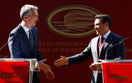 NATO Secretary-General Jens Stoltenberg and Macedonia's Prime Minister Zoran Zaev shake hands after a news conference in Skopje, Macedonia, September 6, 2018. REUTERS/Ognen Teofilovski