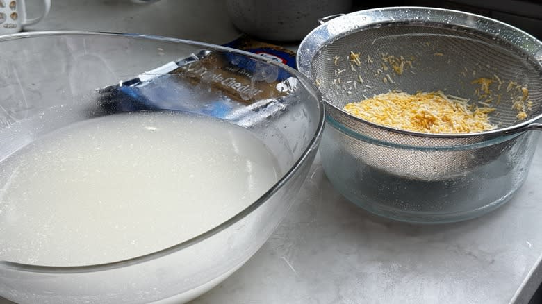 murky water from washing shredded cheese