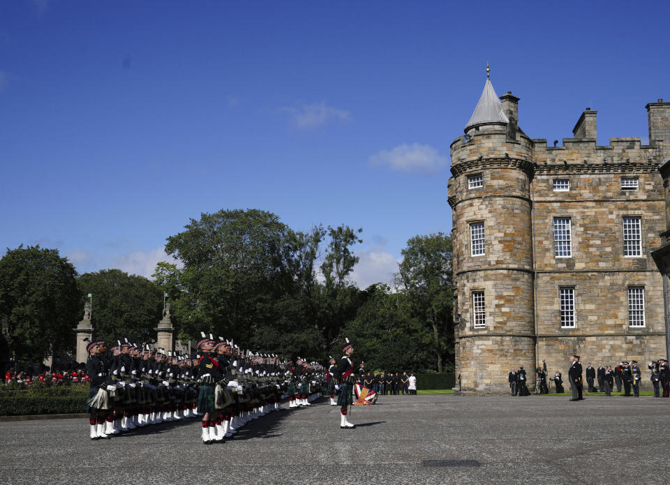 King Charles III inspects the Guard of Honour as he arrives to attend the Ceremony of the Keys, at the Palace of Holyroodhouse, Edinburgh, Monday, Sept. 12, 2022. King Charles arrived in Edinburgh on Monday to accompany his late mother’s coffin on an emotion-charged procession through the historic heart of the Scottish capital to a cathedral where it will lie for 24 hours to allow the public to pay their last respects. (Peter Byrne/Pool Photo via AP)