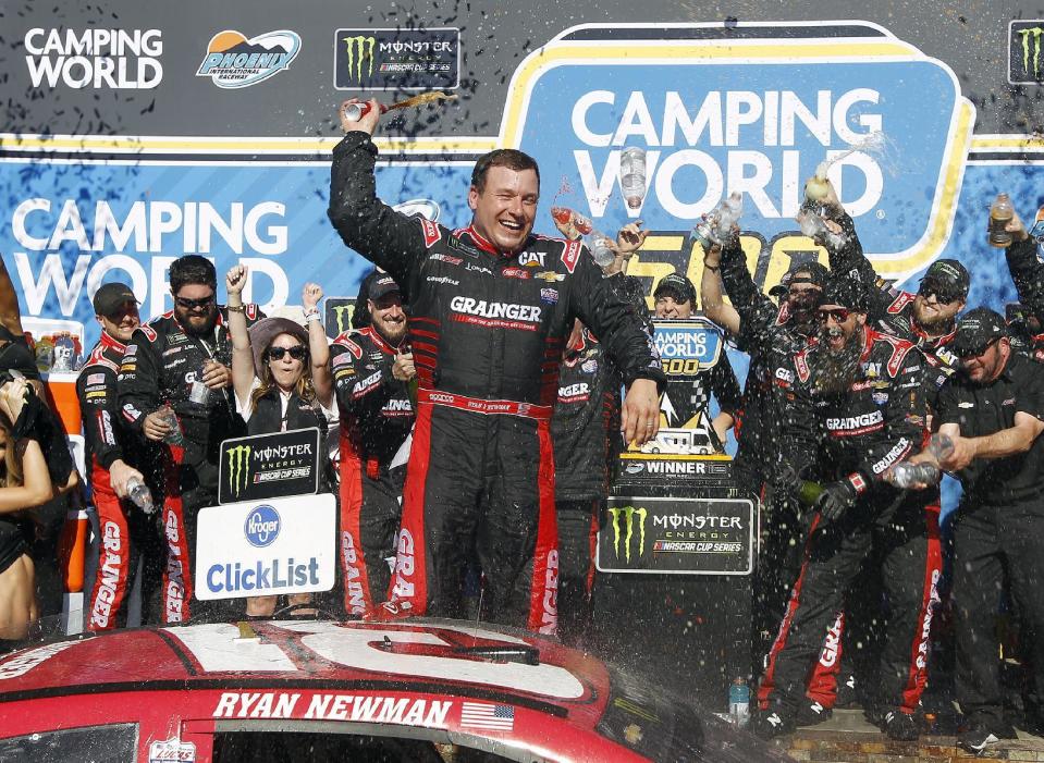 Ryan Newman celebrates in Victory Lane after winning the NASCAR Cup Series auto race at Phoenix International Raceway, Sunday, March 19, 2017, in Avondale, Ariz. (AP Photo/Ralph Freso)