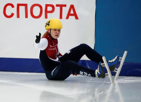 Ekaterina Konstantinova of Russia falls as she competes during the women's 3000m relay semifinals at the ISU World Short Track Speed Skating Championships in Moscow March 14, 2015. REUTERS/Grigory Dukor