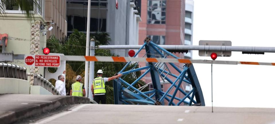 A construction worker was killed and two people were taken to the hospital after a portion of a crane dropped onto the Southeast Third Avenue bridge over the New River in downtown Fort Lauderdale on Thursday afternoon, April 4, 2024. (Carline Jean/South Florida Sun Sentinel)