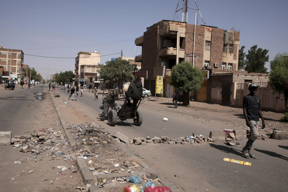 People set up a barricades as part of a civil disobedience campaign following the killing of 7 anti-coup demonstrators in Khartoum, Sudan, Tuesday, Jan.18, 2022. The pro-democracy movement condemned Monday's deadly shootings and called for a two-day civil disobedience campaign over the security forces' actions. (AP Photo)