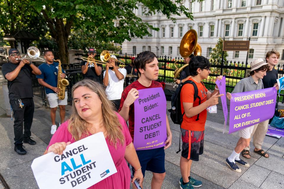 Too Much Talent Band performs during a rally to urge President Joe Biden to cancel student debt near the White House in Washington, D.C., Wednesday, July 27, 2022.