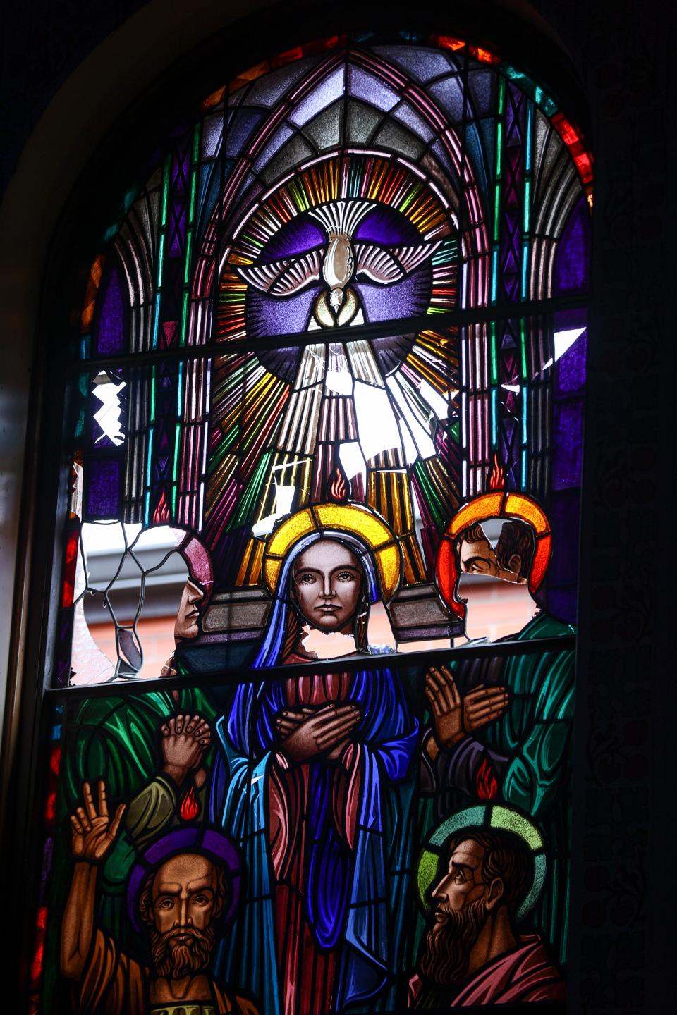 The stained glass window of pentecost after the fire at St. Joseph Catholic Church.