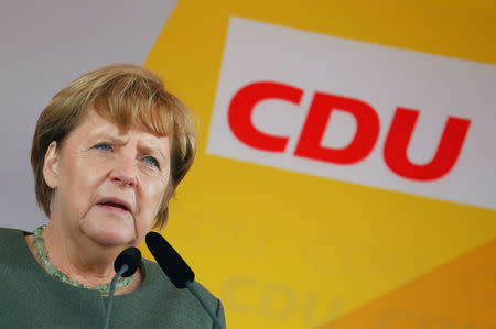 German Chancellor Angela Merkel, a top candidate of the Christian Democratic Union Party (CDU) for the upcoming general elections, reacts during a speech as she campaigns in Barth, Germany, September 8, 2017. REUTERS/Fabrizio Bensch