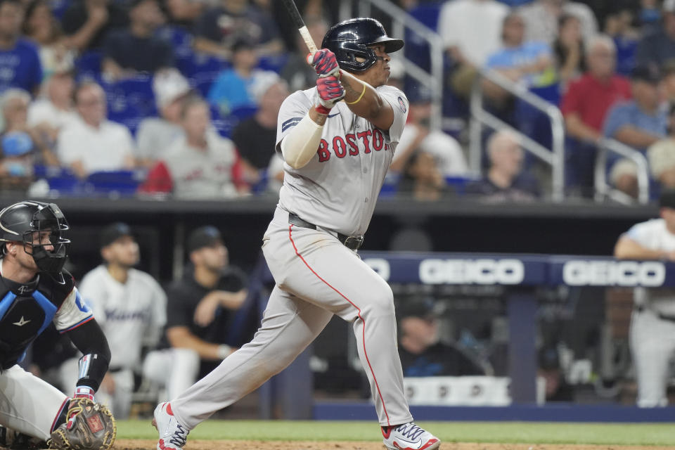 Boston Red Sox's Rafael Devers hits a single during the seventh inning of a baseball game against the Miami Marlins, Tuesday, July 2, 2024, in Miami. (AP Photo/Marta Lavandier)