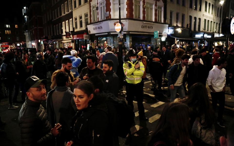 LONDON, UNITED KINGDOM - APRIL 12: People crowd the Soho area after restaurants and pubs, which were closed within the nationwide lockdown imposed to stem the spread of coronavirus (COVID-19), re-open in London, United Kingdom on April 12, 2021. Restaurants and pubs are made available to serve outdoors with the easing of COVID-19 measures. Easing of nationwide lockdown, imposed since January 5th, began. (Photo by Hasan Esen/Anadolu Agency via Getty Images)