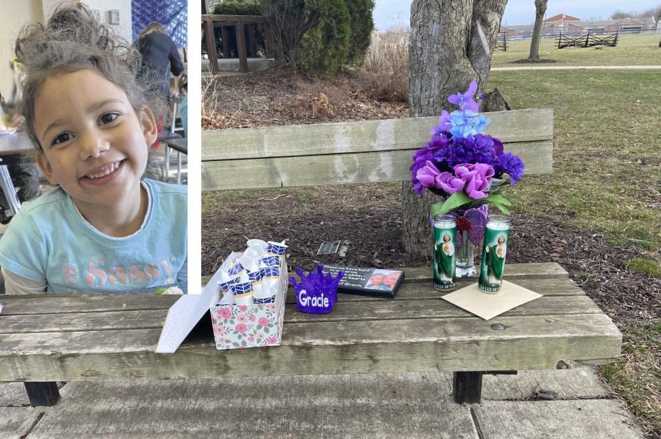 Flowers and candles are placed on a bench at Memorial Park in New Carlisle in honor of Grace Ross, the 6-year-old girl whose body was found in March 2021.